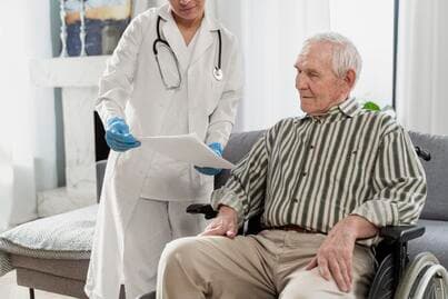 doctor talking senior man indoors (1) (1)